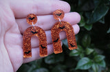 Orange Glitter and Bats Resin Earrings