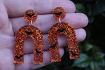 Orange Glitter and Bats Resin Earrings